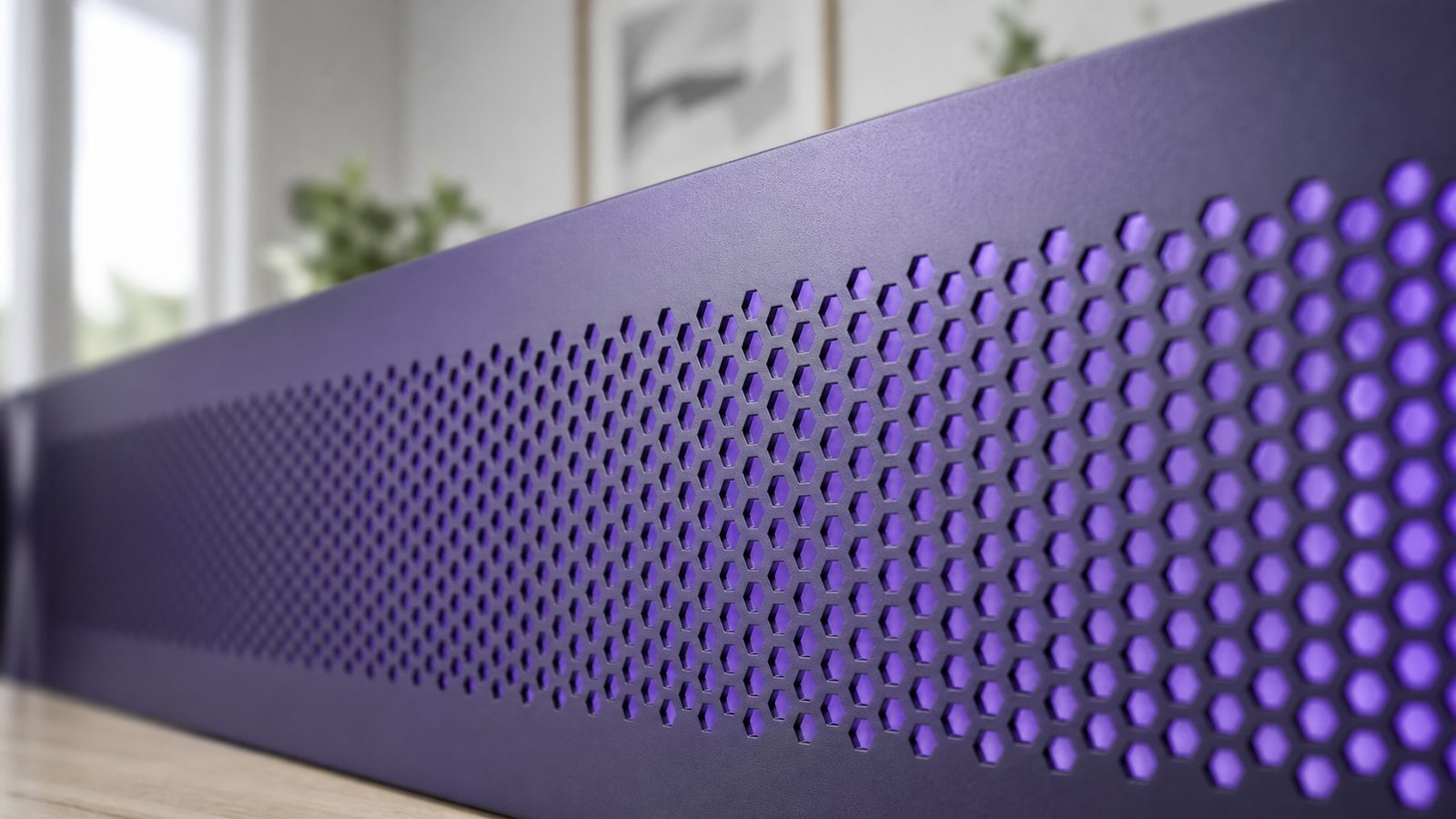 Close-up of the glowing violet perforated front grille of a local AI server chassis